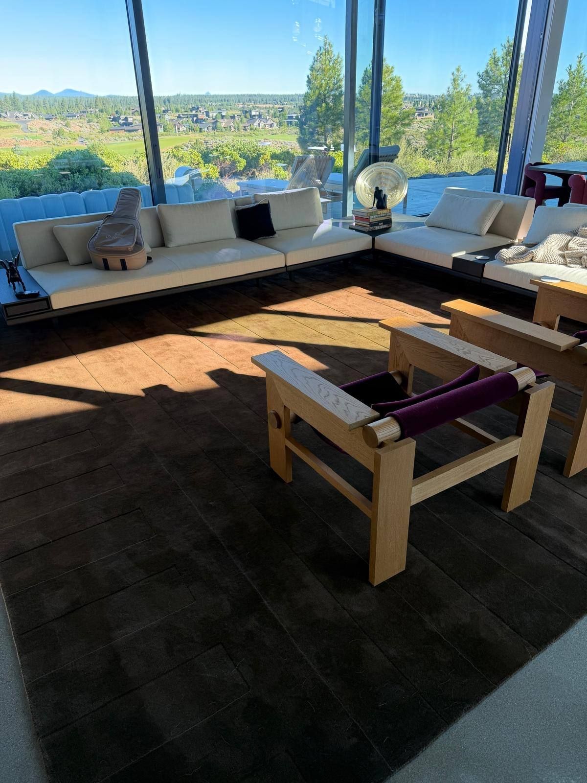 Oak armchair against a full-height window looking over the valley, Oregon